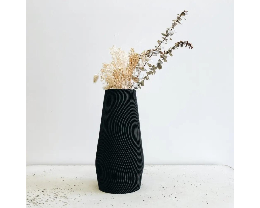 3D-printed vase with wave texture in black. Made in France